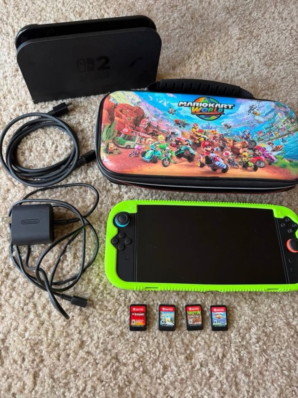 Handheld Console with Green Case and Mario Kart Carry Case